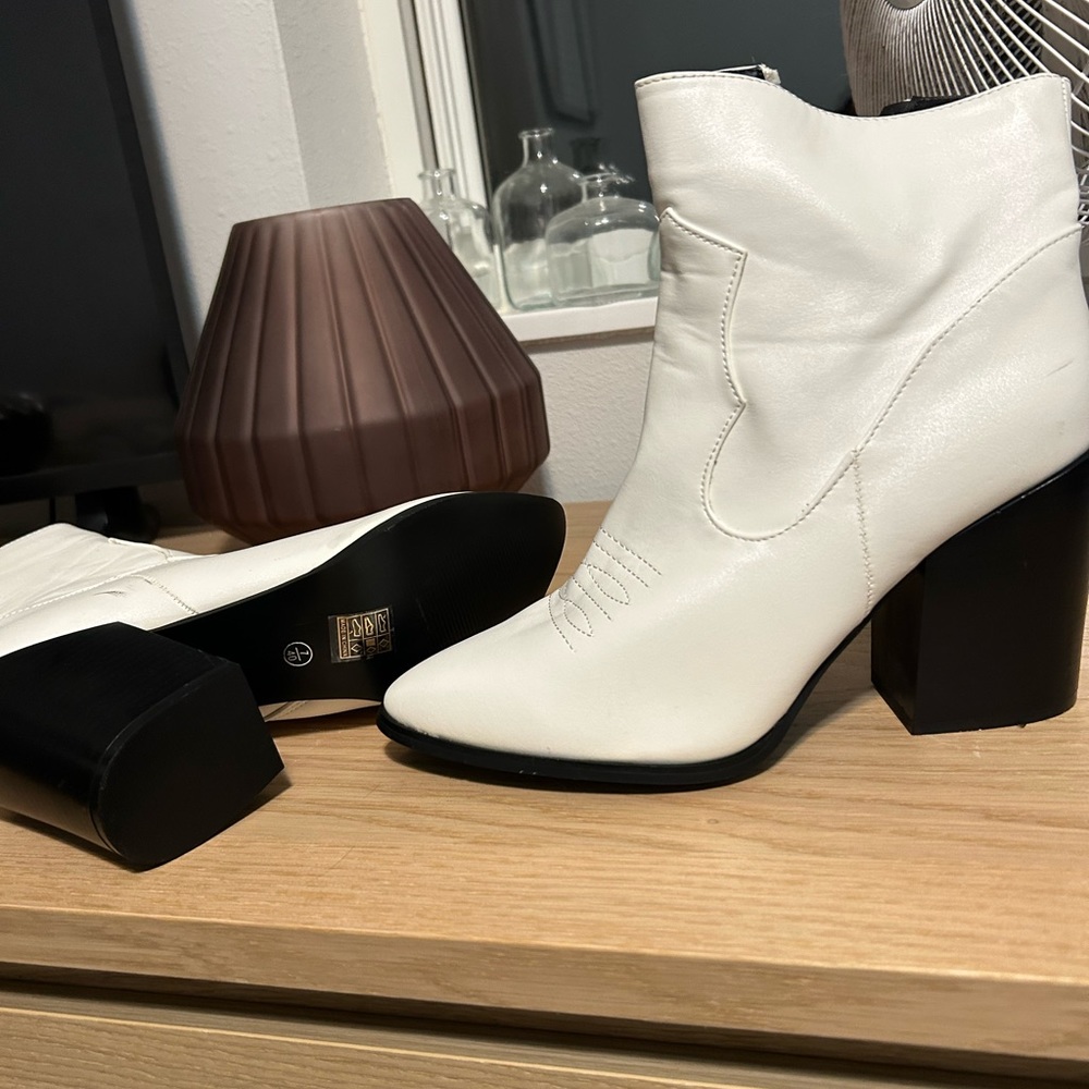 Short white cowboy boots.
